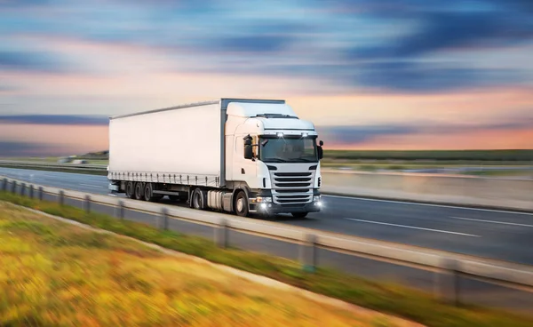 depositphotos_212828960-stock-photo-truck-with-container-on-road.webp